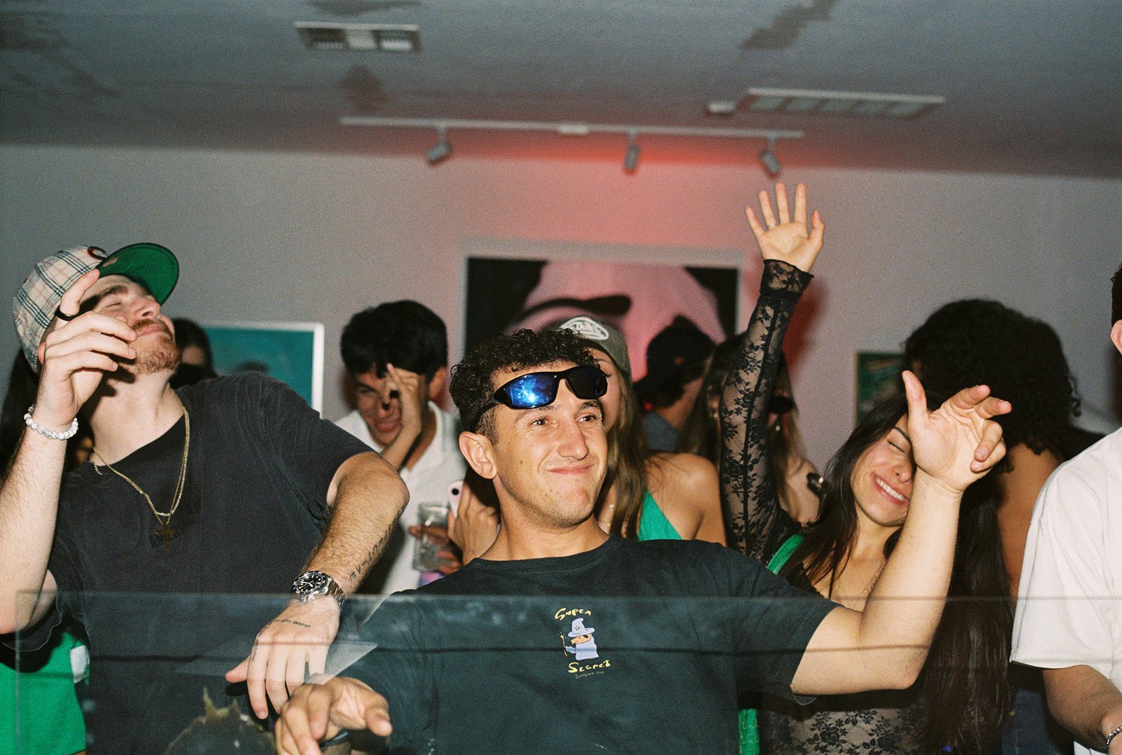 Guests dancing with their hands up